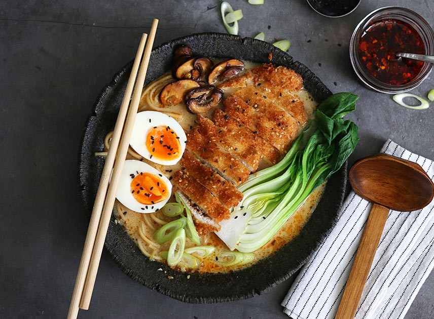 Delicious miso ramen bowl with soft-boiled egg and fresh toppings